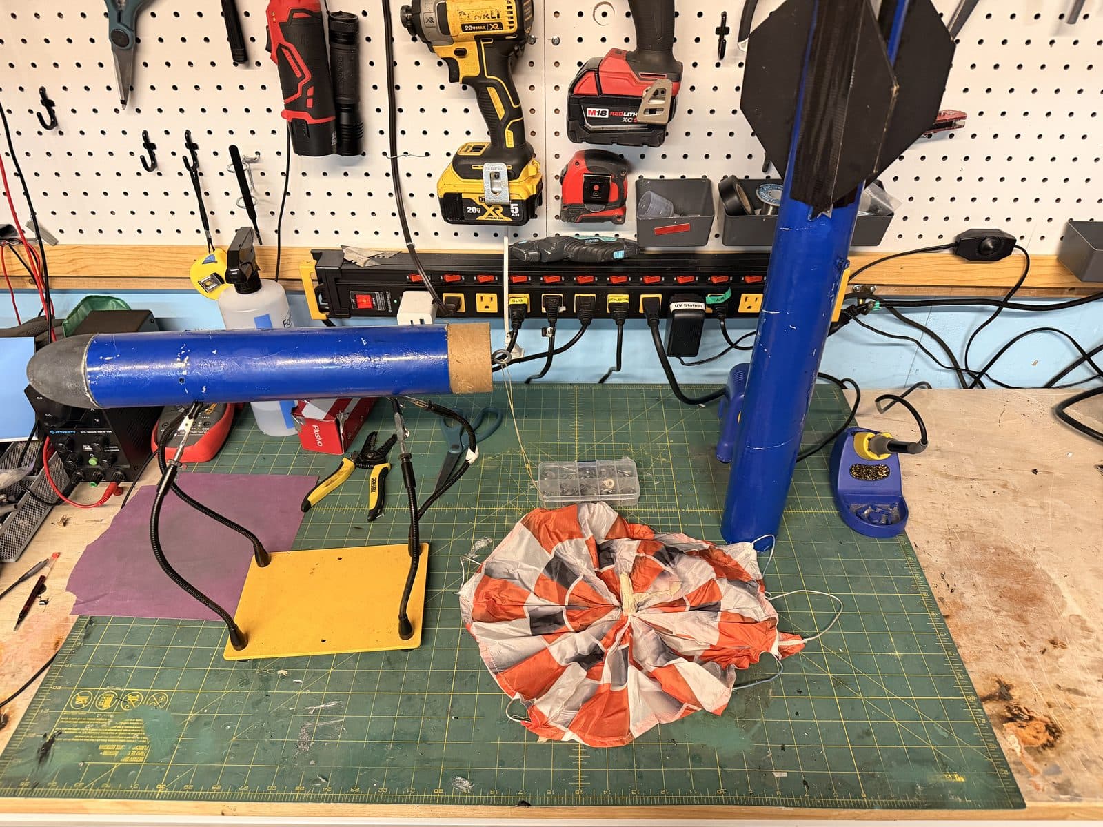 Students preparing a rocket on the launch pad